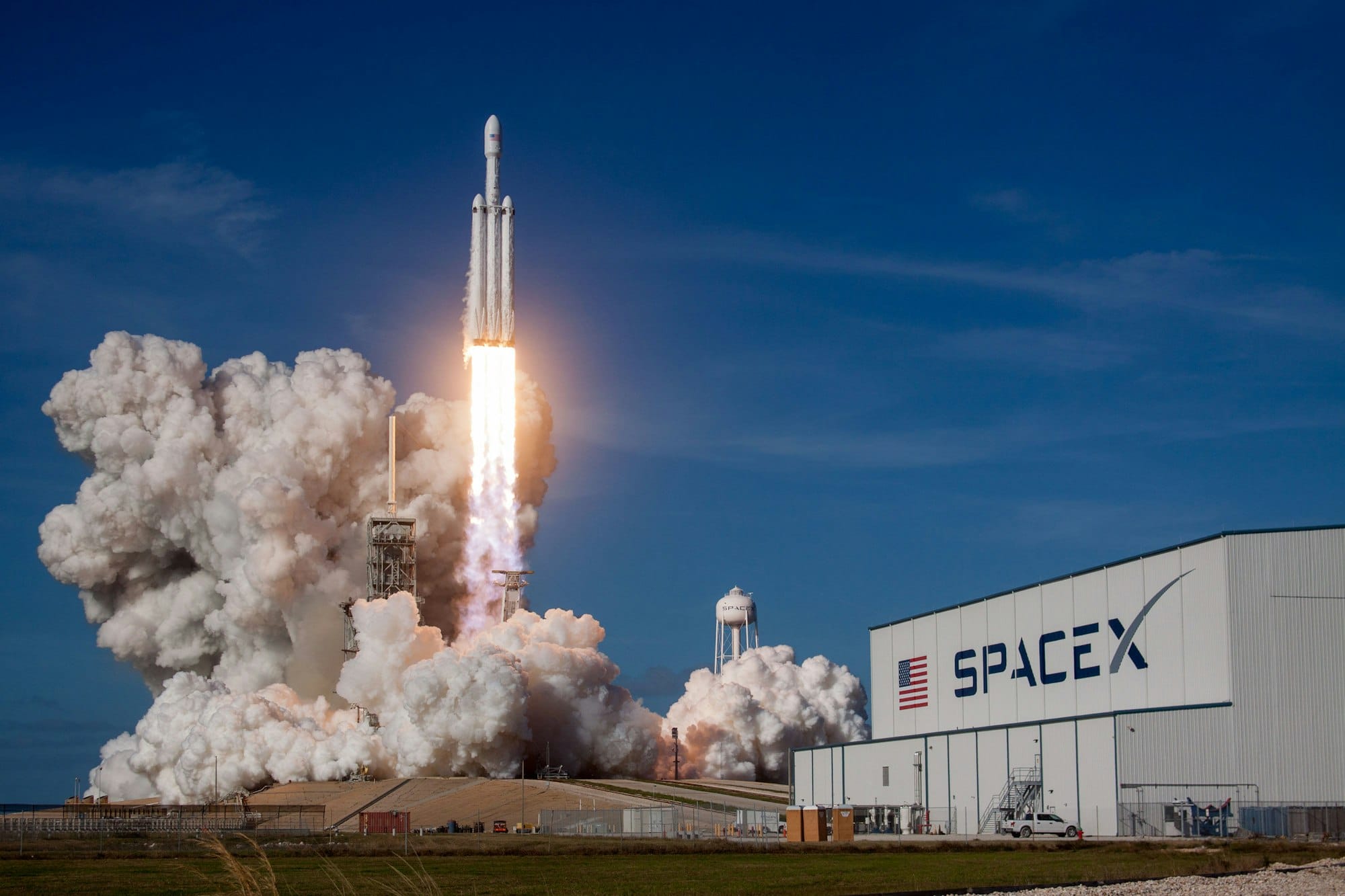 SpaceX Falcon Heavy launches from Kennedy Space Center during a commercial mission, illustrating the aerospace company behind the 2026 Nasdaq IPO.